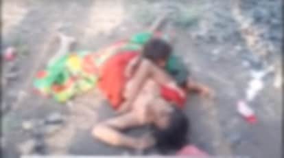 Video of toddler suckling on dead mother's breast near railway