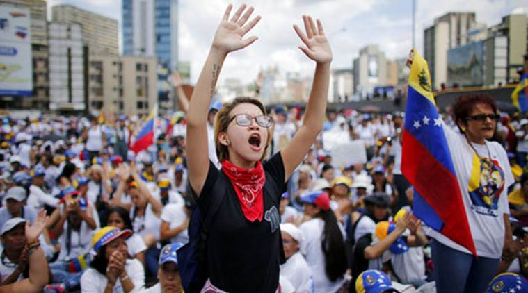 Venezuela, Venezuela Crisis, Venezuela Protest March, Chavez statue, World News, Latest World News, Indian Express, Indian Express News