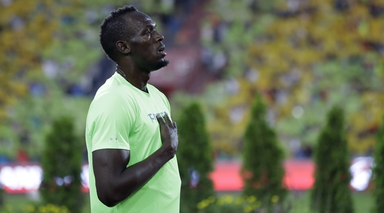 Usain Bolt seeks quick fix for back issue with doctor Hans-Wilhelm ...