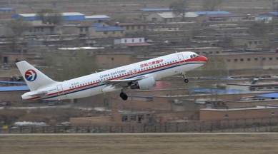 chinese passenger throws coin in plane, coins in plane engine, China coins thrown in plane's engine, Shanghai Pudong International Airport, indian express news