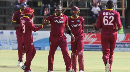 West Indies players celebrate a wicket against Sri Lanka during the One Day cricket match between the two teams at Harare Sports Club in Harare, Wednesday, Nov, 16, 2016. The two teams are playing in a triangular series featuring Zimbabwe.(AP Photo/Tsvangirayi Mukwazhi)