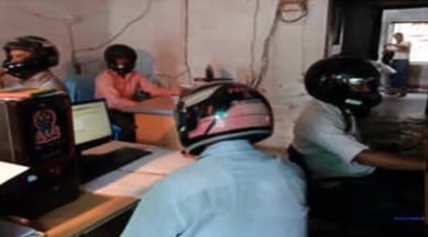 bihar, bihar govt office, bihar govt office helmet, bihar govt staff wear helmet to office, bihar news, bizarre news, odd news, weird news, indian express