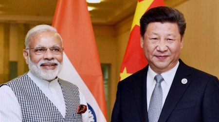 Tashkent : Prime Minister Narendra Modi with Chinese President Xi Jinping during a meeting in Tashkent on Thursday on the sidelines of SCO Summit. PTI Photo (PTI6_23_2016_000094B)