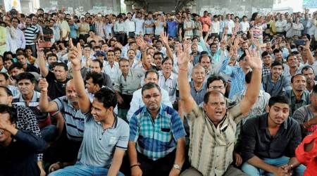 Surat: Textile traders chant slogans during a protest against GST in Surat on Thursday. PTI Photo  (PTI7_6_2017_000069B)