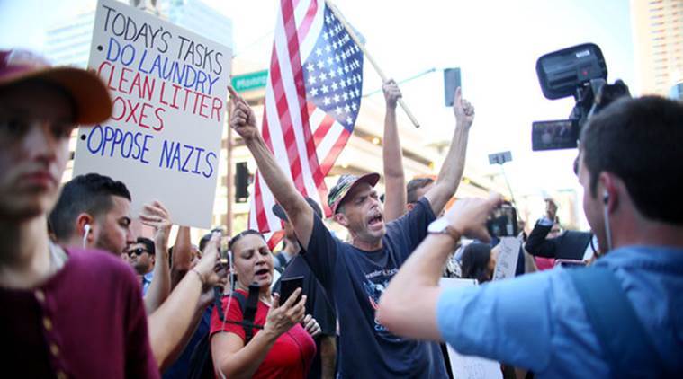 Police fire pepper spray to disperse protesters outside Trump rally in ...