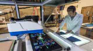 Nike, Nike sneakers, Nike shoemaking process, robots, Grabit, electroadhesion, upper-assembly machines, shoemaking economics, Nike consumer markets, Grabit machines, Nike competition, Adidas future plans, worker requirement