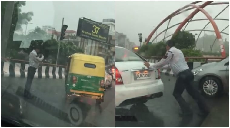 delhi traffic policeman, delhi traffic policeman in rains, traffic policeman respect working in rains, delhi traffic policeman video of qorking in rains viral, delhi traffic policeman video viral, delhi traffic policeman controlling traffic viral, indian express, indian express news
