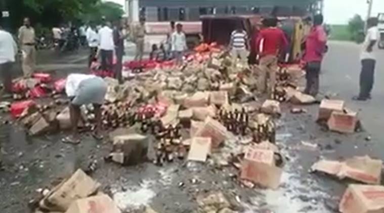 VIDEO: Villagers loot beer bottles after truck carrying them topples in Telangana | Trending News,The Indian Express