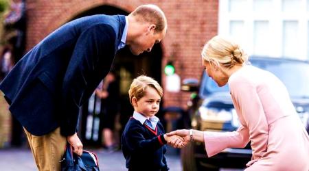 Britain's Prince William accompanies Prince George as he is met by Helen Haslem - the head of the lower school on arrival for his first day of school at Thomas's school in Battersea, London. (File/AP)