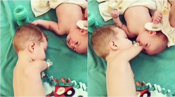 baby, baby videos, toddler videos, sibling videos, elder brother help baby, boy without arm help baby, viral video, indian express