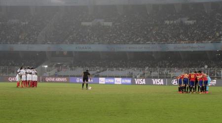 Team Spain, right, and team England huddle together before the start of their FIFA U-17 World Cup final match in Kolkata, India, Saturday, Oct. 28, 2017. (AP Photo/Bikas Das)