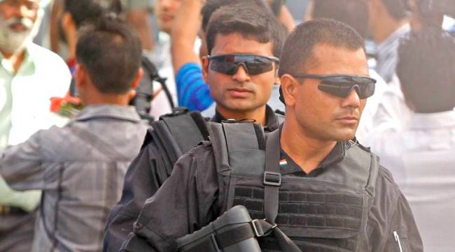 Commandos of Special Protection Group come in before AICC General Secretary Rahul Gandhi enters the venue at the Panjab University in Chandigarh on Thursday, October 11 2012. Express photo by Sumit Malhotra