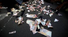 Pieces of old fake 1000 rupee notes lay on the street during a protest, organised by India’s main opposition Congress party, to mark a year since demonetisation was implemented by Prime Minister Narendra Modi, in Ahmedabad Demonetisation, Demonetisation anniversary, Narendra Modi, BJP, NPA