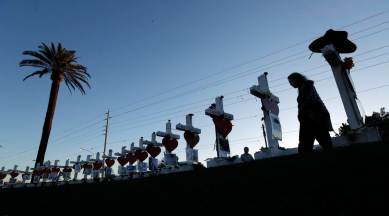 Las Vegas pauses but looks ahead a year after mass shooting