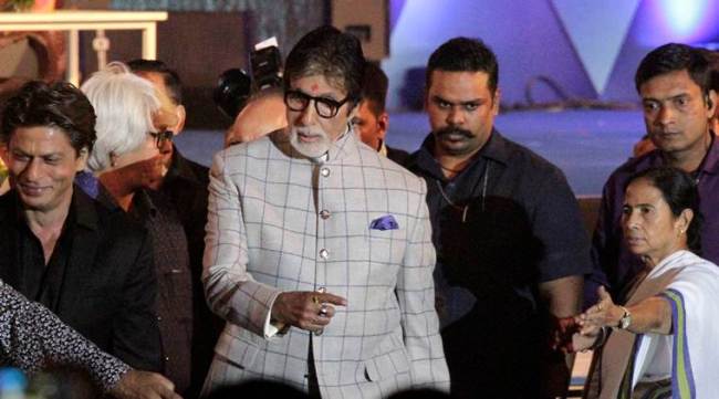 Bollywood actors Amitabh Bachchan, center, and Shah Rukh Khan, left, and Chief Minister of West Bengal state Mamata Banerjee attend the inauguration of 23rd Kolkata International Film Festival in Kolkata, India, Friday, Nov. 10, 2017. The festival will continue till Nov. 17. (AP Photo/Bikas Das)