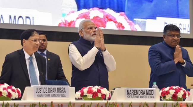 New Delhi: Prime Minister Narendra Modi with Chief Justice of India, Justice Dipak Misra and Union Law Minister Ravi Shankar Prasad at valedictory session of the  National Law Day, 2017 function in New Delhi on Sunday. PTI Photo by Kamal Kishore  (PTI11_26_2017_000220A)