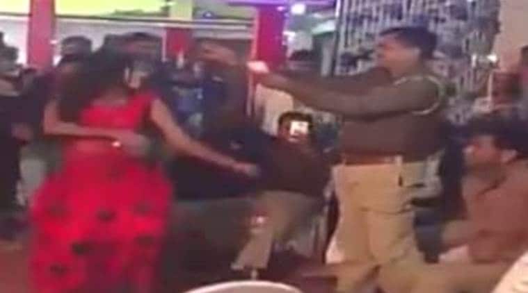 uttar pradesh, uttar pradesh police, uttar pradesh police video, police showers money on dancer, policeman suspended,  uttar pradesh police dancer