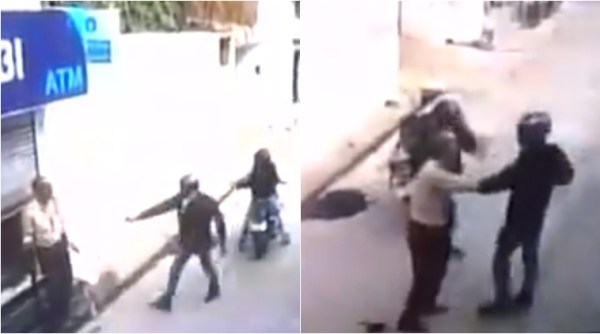 guard protects atm from armed robbers, guard does not let robbers enter atm, guard stops robbery, viral video,