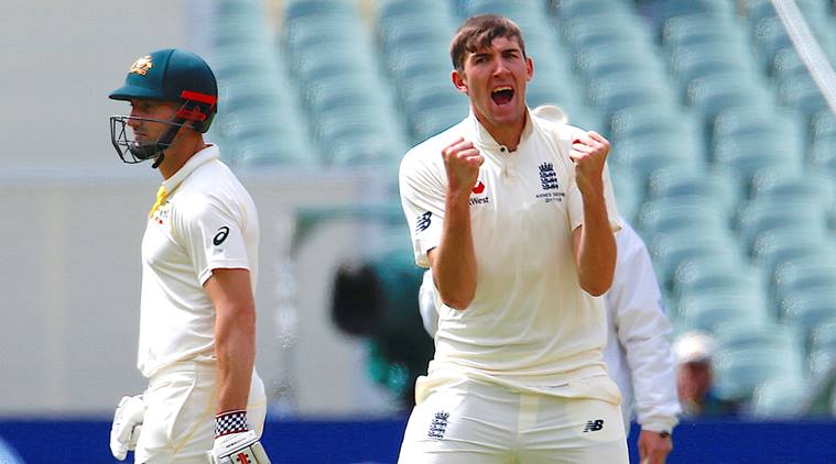 England's Craig Overton celebrates after the wicket of Tim Paine against Australia