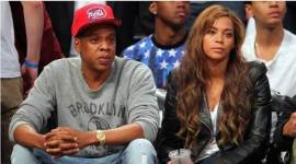 Jay-Z and Beyonce look on during the third quarter of game