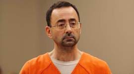 Michigan State official who oversaw Nassar faces charges