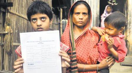 The wife, daughter of Anowar Hussain. He was found dead after failing to secure papers for the 9-year-old. (Express Photo: Dasarath Deka)