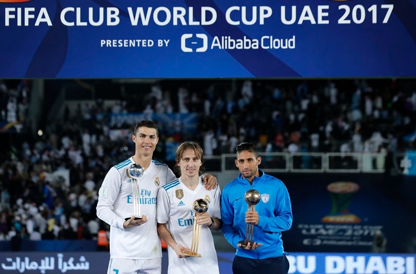 Cristiano Ronaldo, Luka Modric and Jonathan Urretaviscay with respective trophies after Club World Cup