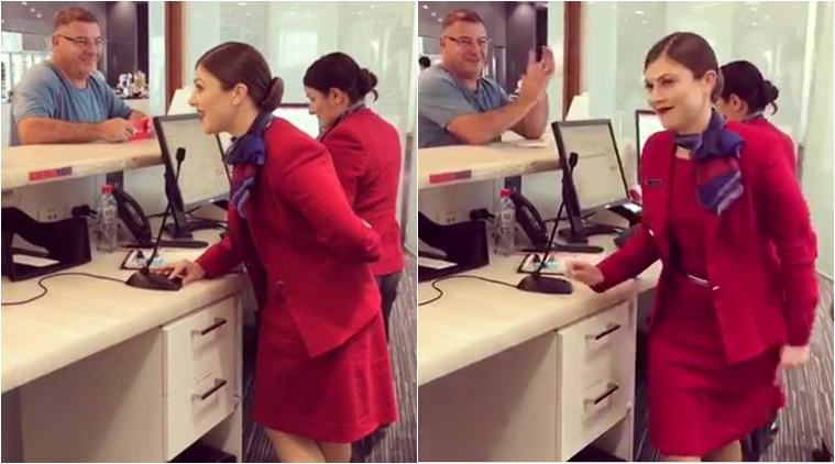 christmas, christmas carol, christmas carol airport, virgin australia, viral video, flight attendent sing christmas song, indian express