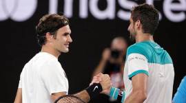 Roger Federer and Marin Cilic at the net following Australian Open final