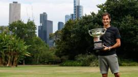 Roger Federer with the Australian Open trophy at governer's house