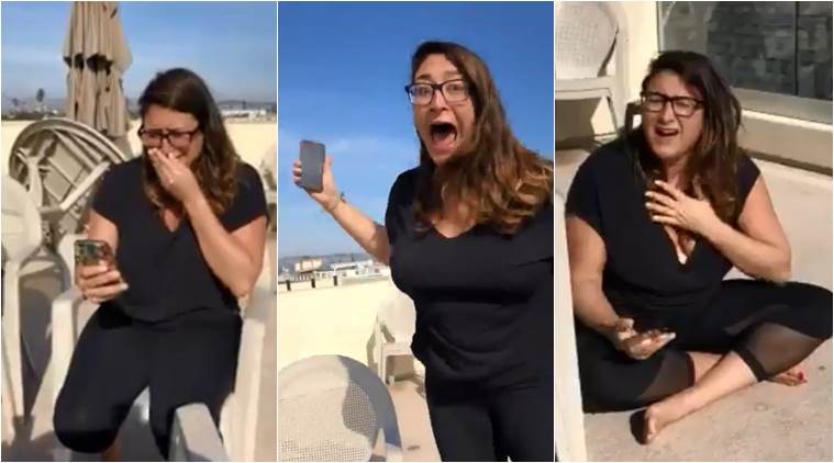 woman wins lottery, viral video of woman winning money, san francisco woman winning money, funny reaction of woman winning money, indian express, indian express news