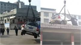 viral video, social media, viral china video, car lifted on building roof, china news