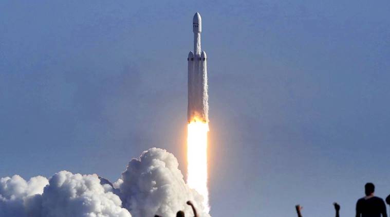 Watch Video Spacexs Falcon Heavy Takes Off Puts Tesla