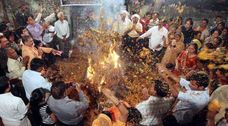 Residents of Sector 46 celebrating “Holika Dahan” on the eve of Holi at Sanatan Dharma Mandir in Chandigarh on Tuesday, March 26 2013. Express photo by Jasbir Malhi