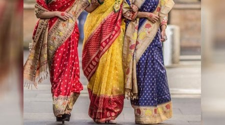 three women wearing sari