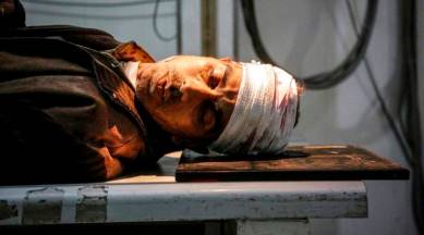 Syrian activists say shelling of Damascus suburb killed 98 people