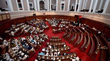 Kolkata: Finance Minister Amit Mitra present the state budget 2017-18 in the Legislative Assembly as opposition party MLAs boycott the session, in Kolkata on Friday. PTI Photo by Swapan Mahapatra (PTI2_10_2017_000089B)