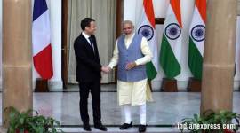Prime Minister Narendra Modi shakes hands with French President Emmanuel Macron before their meeting at Hyderabad House in New Delhi on Saturday. (Express photo/Amit Mehra)