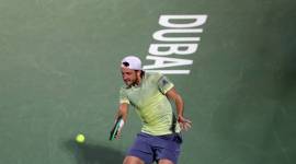 Lucas Pouille in action at the Dubai ATP tournament