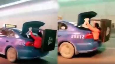 funny video, woman sit on taxi dicky, woman travel in taxi trunk, viral video, trending news, indian express