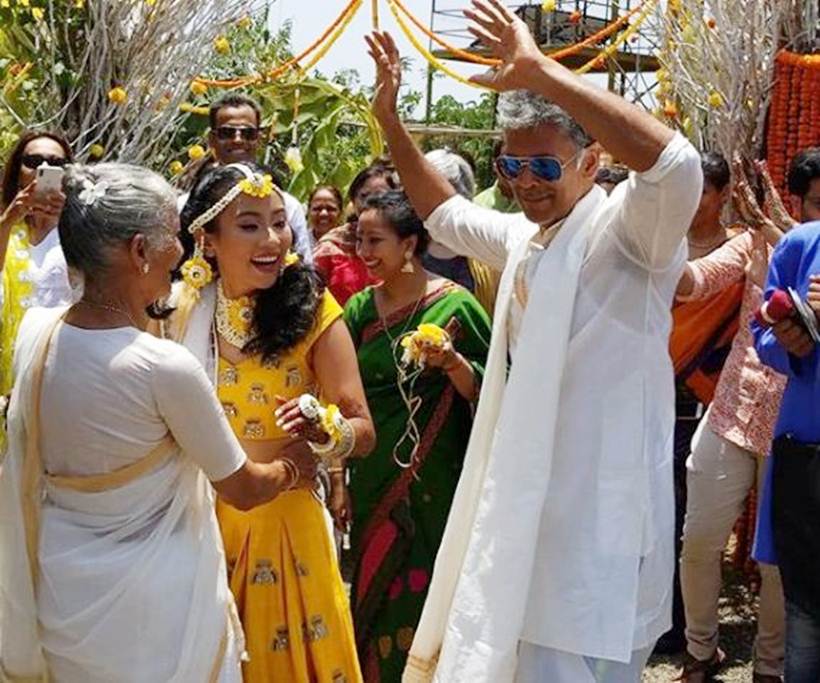milind soman and ankita konwar during a wedding ceremony
