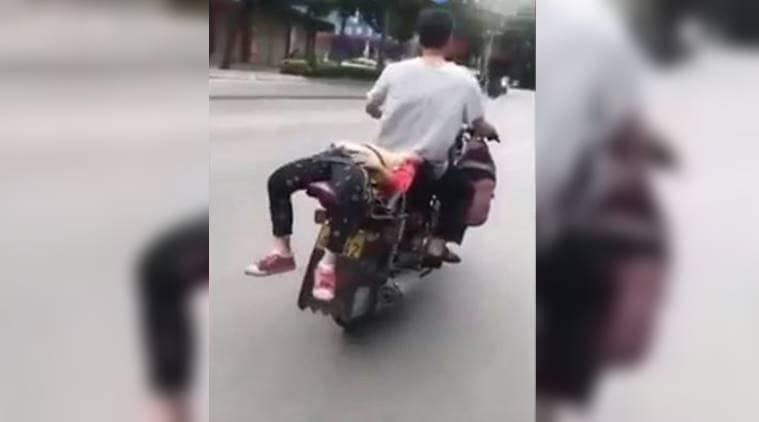 VIDEO Father Ties Daughter On His Bike As She Refuses To Go To School