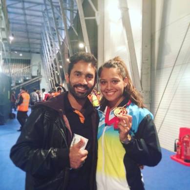Dinesh Karthik and wife Dipika Pallikal pose at an airport