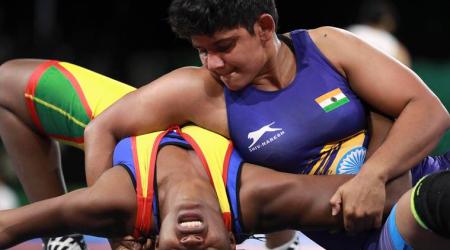 Wrestling - Gold Coast 2018 Commonwealth Games - Women's Freestyle 76 kg - 1/4 Final - Carrara Sports Arena 1 - Gold Coast, Australia - April 12, 2018. Danielle Sino Guemde of Cameroon and Kiran of India compete. REUTERS/Athit Perawongmetha