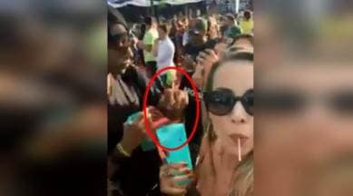 man spiking drinks, man spiking drinks of girls, man spiking drinks caught on camera, viral videos, indian express, indian express news