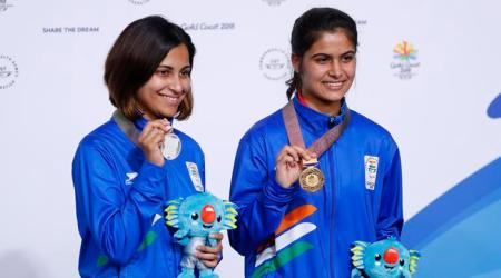 Shooting - Gold Coast 2018 Commonwealth Games - Women's 10m Air Pistol - Finals - Belmont Shooting Centre - Brisbane, Australia - April 8, 2018. Gold medallist Manu Bhaker of India and silver medallist Heena Sidhu of India pose with their medals and Borobi plush dolls. REUTERS/Eddie Safarik