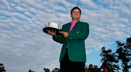 Patrick Reed holds the championship trophy after winning the Masters golf tournament Sunday, April 8, 2018, in Augusta, Ga. (AP Photo/David J. Phillip)