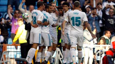 Real Madrid players celebrate a goal against Leganes during a Spanish La Liga soccer match at the Santiago Bernabeu stadium in Madrid