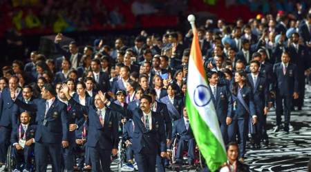 Gold Coast: Flagbearer PV Sindhu leads the Indian contingent at Carrara Stadium during the opening ceremony of 2018 Commonwealth Games, Gold Coast in Australia on Wednesday. PTI Photo by Manvender Vashist  (PTI4_4_2018_000168A)