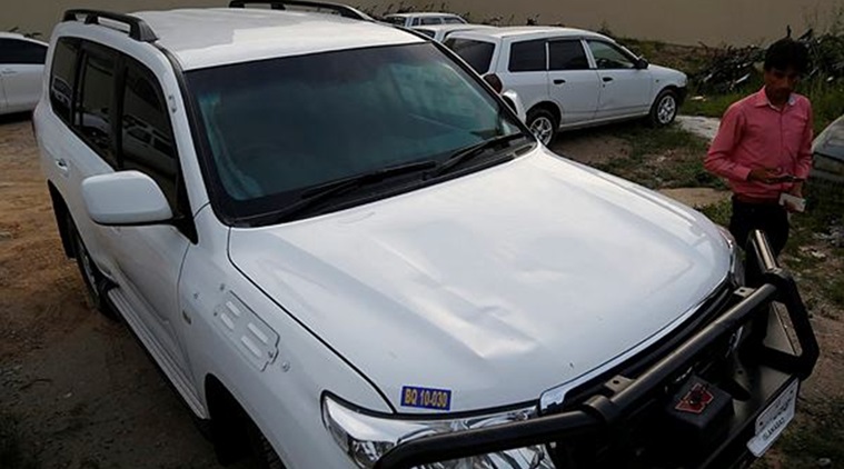 A Pakistani journalist examines a car of the American diplomate parked inside a police station after the accident in Islamabad on Saturday. (Photo: AP)